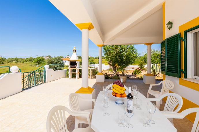 Sheltered terrace area with BBQ . - Villa Sol Nascente . (Photo Gallery) }}