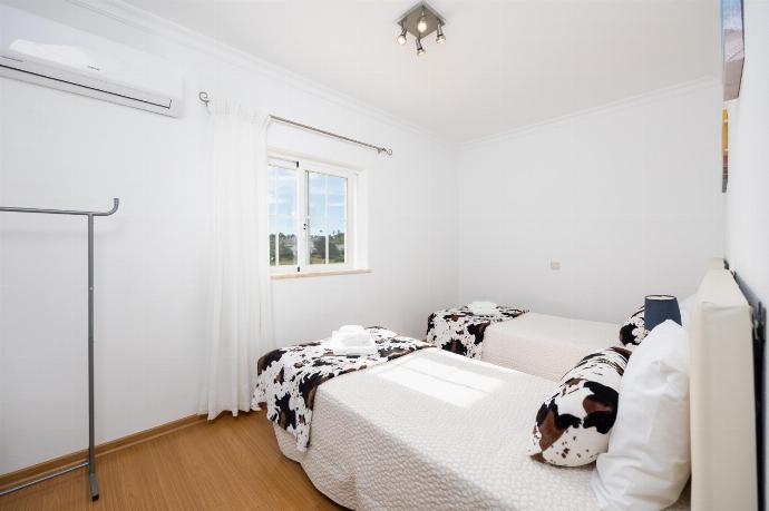 Twin bedroom with A/C . - Villa Marlene . (Photo Gallery) }}