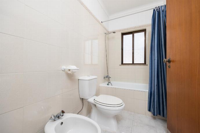 En suite bathroom with bath and shower . - Villa Cavaco . (Photo Gallery) }}