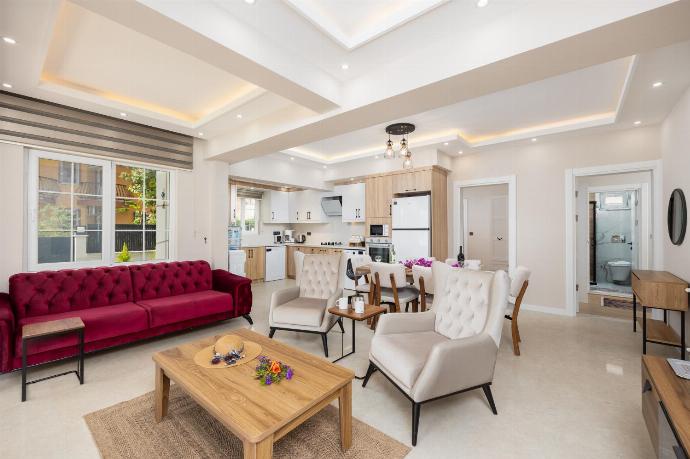 Open-plan living room with sofa, dining area, kitchen, A/C, WiFi internet, and satellite TV . - Villa Central . (Photo Gallery) }}
