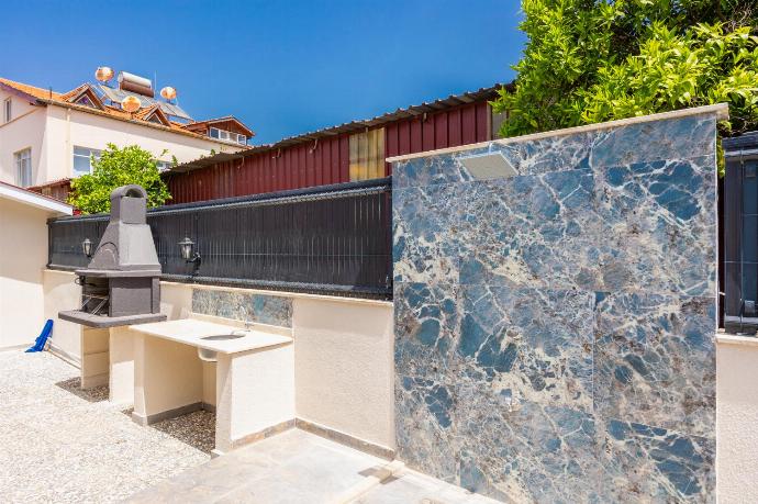 Terrace area with BBQ and outdoor shower . - Villa Central . (Photo Gallery) }}