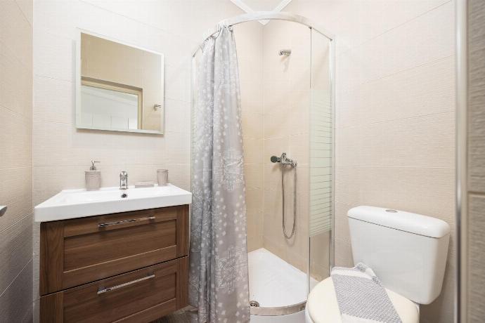 En suite bathroom with shower . - Levrecchio Beach Cottage . (Photo Gallery) }}