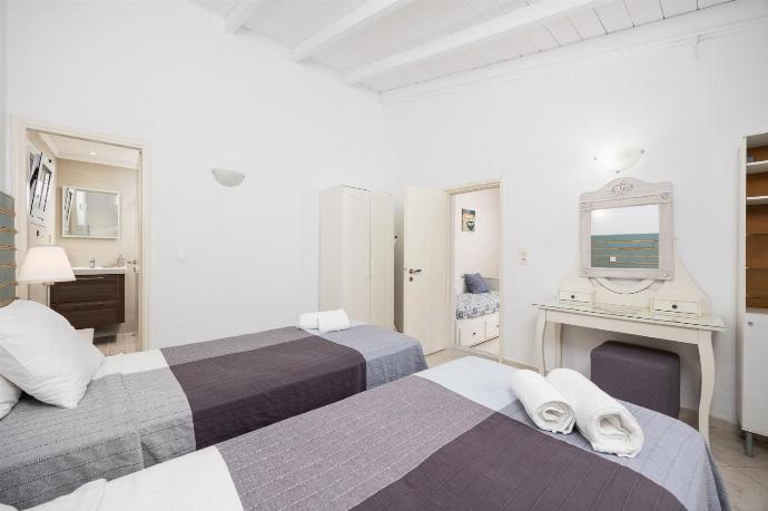 Twin bedroom with en suite bathroom and A/C . - Levrecchio Beach Cottage . (Photo Gallery) }}