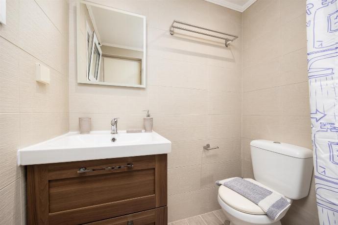 En suite bathroom with shower . - Levrecchio Beach Cottage . (Photo Gallery) }}