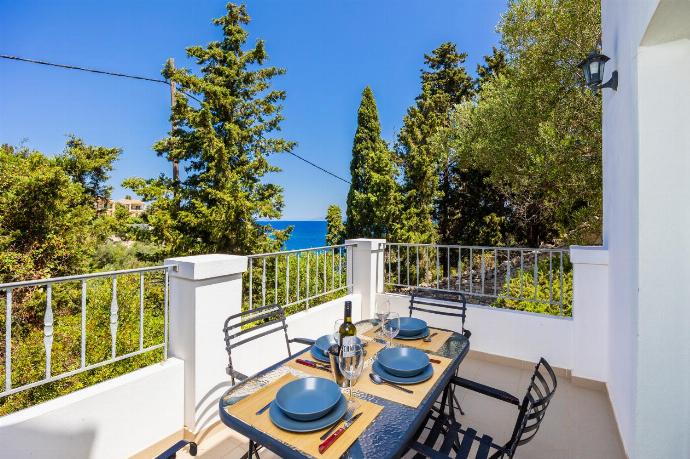 Terrace area with sea views . - Villa Marmari . (Photo Gallery) }}