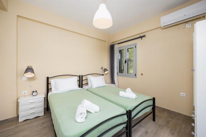 Twin bedroom with A/C . - Villa Marmari . (Photo Gallery) }}