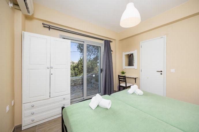 Twin bedroom with A/C . - Villa Marmari . (Photo Gallery) }}