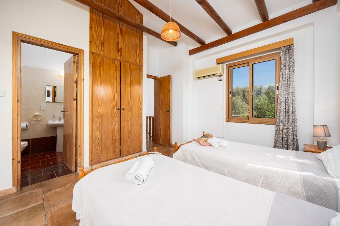 Twin bedroom with en suite bathroom and A/C . - Villa Angela Paradise . (Photo Gallery) }}