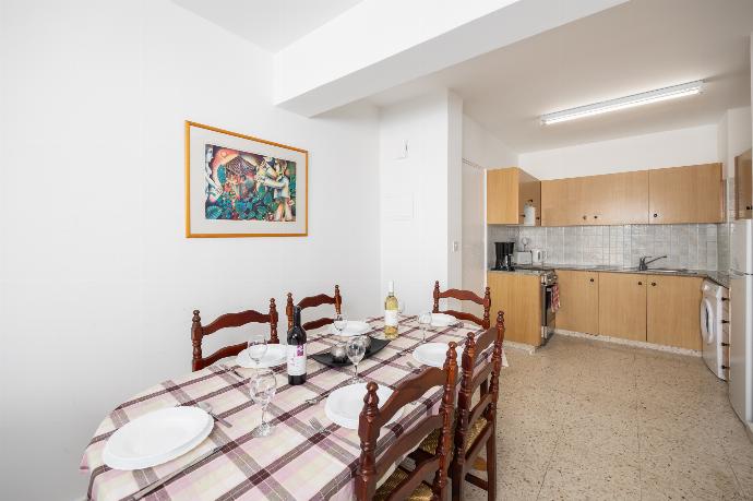 Open-plan living room with sofa, dining area, kitchen, A/C, WiFi internet, and satellite TV . - Bluesea View Latchi Apartment . (Fotogalerie) }}