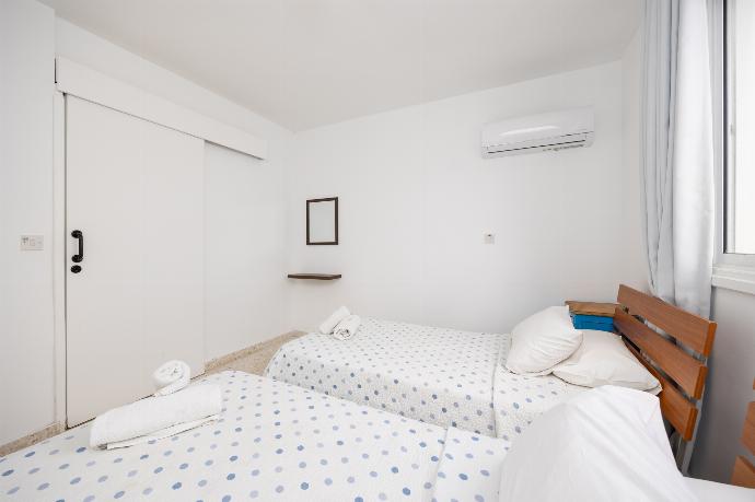 Twin bedroom with A/C . - Latchi Pool Side View Apartment  . (Photo Gallery) }}