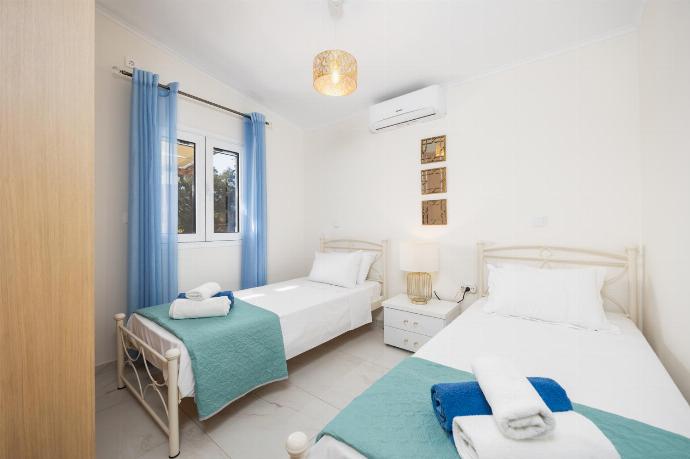 Twin bedroom with A/C . - Villa Eleftheria . (Photo Gallery) }}