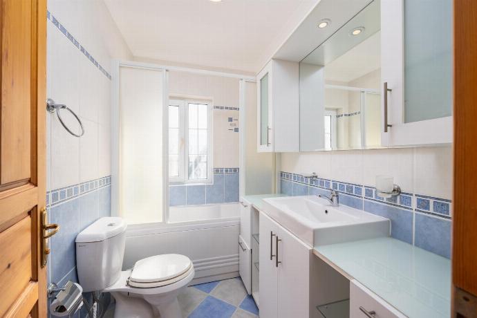 En suite bathroom with bath and shower . - Villa Begonvil . (Photo Gallery) }}