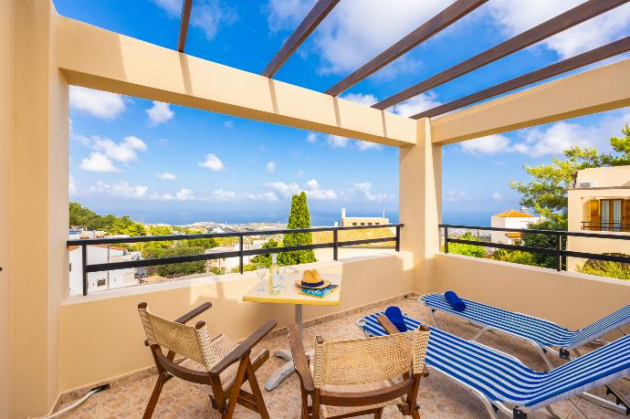 Upper terrace area with sea views . - Villa Evan . (Photo Gallery) }}