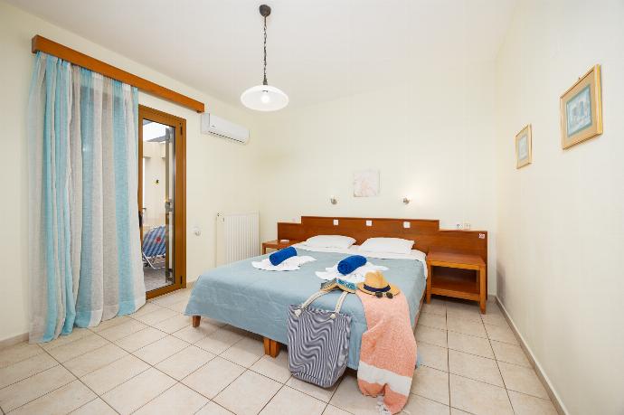 Double bedroom with A/C . - Villa Evan . (Photo Gallery) }}