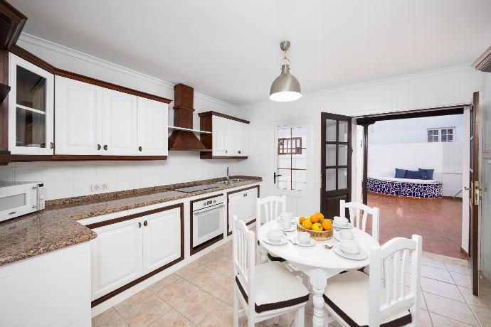 Equipped kitchen with dining area . - Villa Dulce . (Photo Gallery) }}