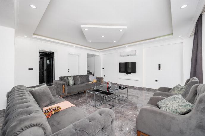 Open-plan living room with sofas, dining area, kitchen, A/C, WiFi internet, and satellite TV . - Villa Grand Yasar 1 . (Photo Gallery) }}