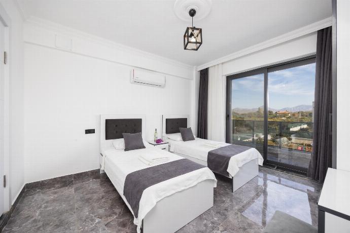 Twin bedroom with en suite bathroom and A/C . - Villa Grand Yasar 1 . (Photo Gallery) }}