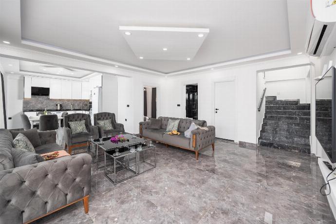 Open-plan living room with sofas, dining area, kitchen, A/C, WiFi internet, and satellite TV . - Villa Grand Yasar 2 . (Photo Gallery) }}