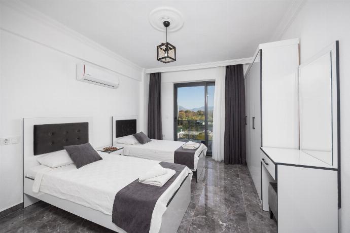 Twin bedroom with A/C and en suite bathroom . - Villa Grand Yasar 3 . (Photo Gallery) }}