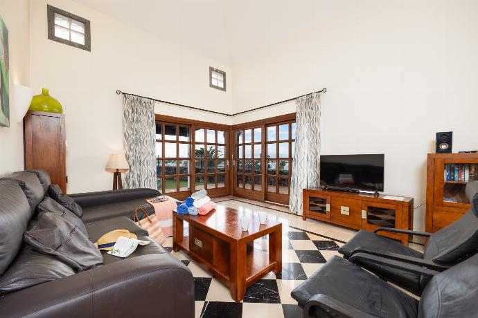 Living room with sofas, WiFi internet, and satellite TV . - Villa Dragos . (Photo Gallery) }}