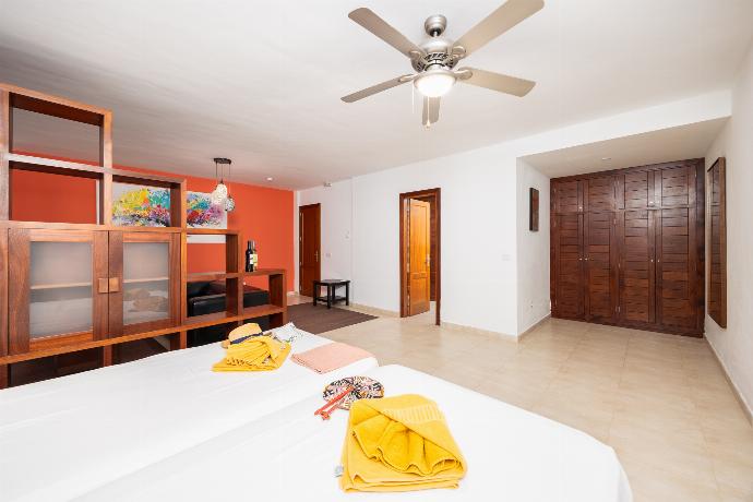 Twin bedroom with en suite bathroom, living area, and A/C . - Villa Dragos . (Photo Gallery) }}