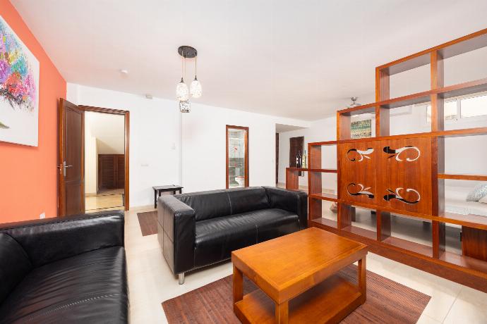 Twin bedroom with en suite bathroom, living area, and A/C . - Villa Dragos . (Photo Gallery) }}