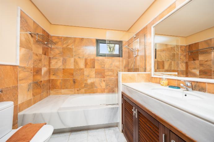 Family bathroom with bath and shower . - Villa Dragos . (Photo Gallery) }}