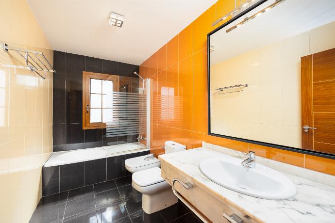 Family bathroom with bath and shower . - Las Caletas . (Photo Gallery) }}