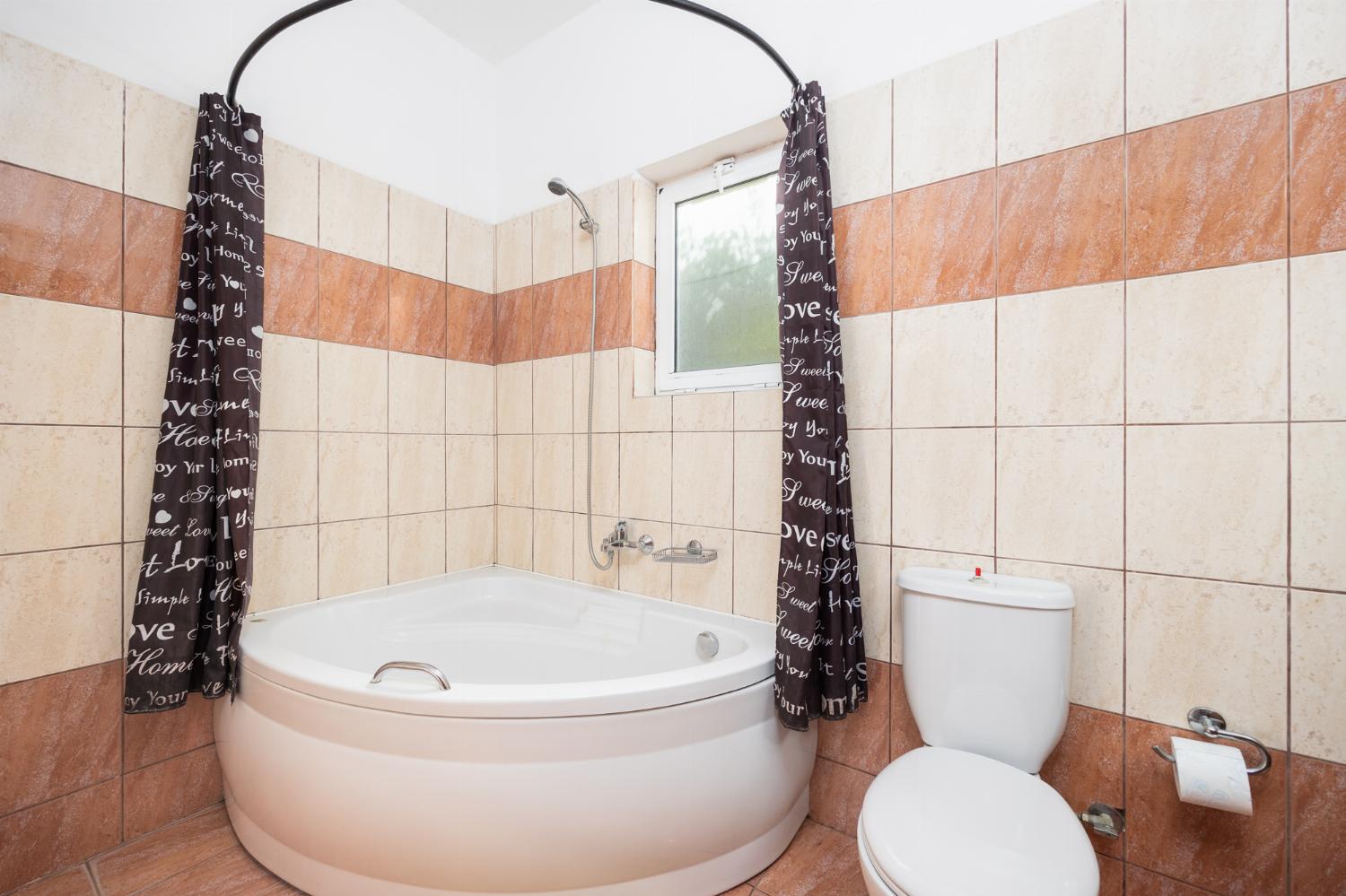 Family bathroom with bath and shower