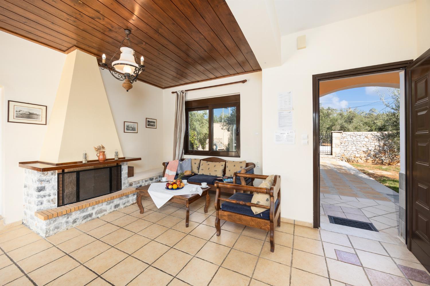 Living room with sofa, ornamental fireplace, WiFi internet, and satellite TV