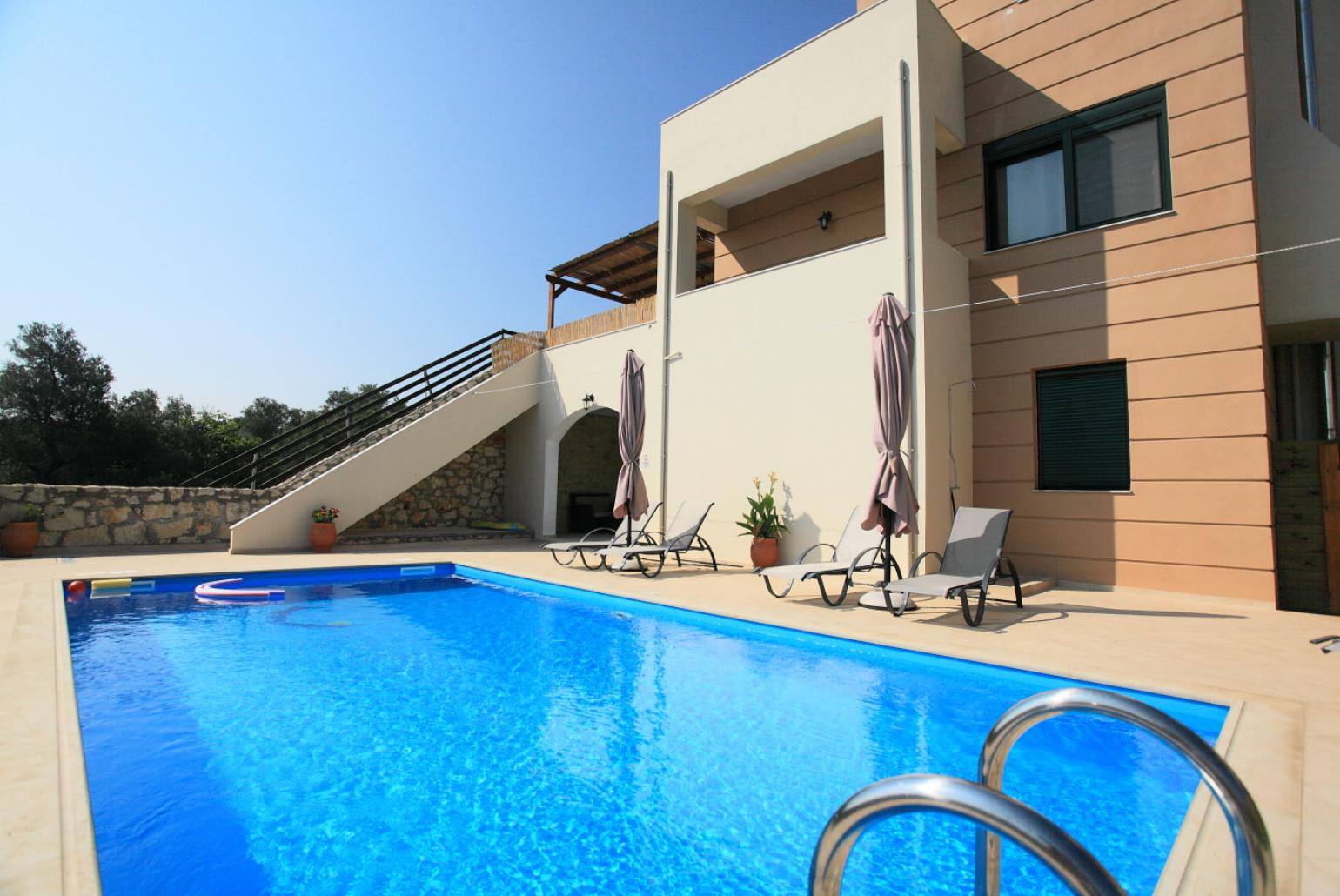 ,Private pool with terrace and garden area