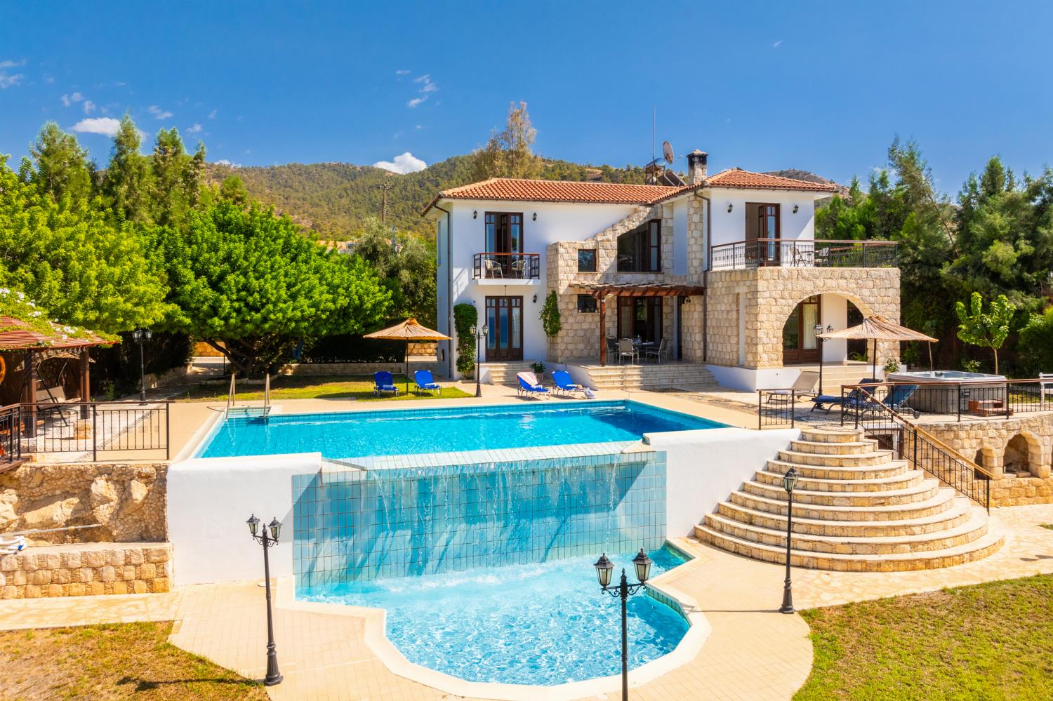 ,Beautiful villa with private pool, terrace, and garden with sea views