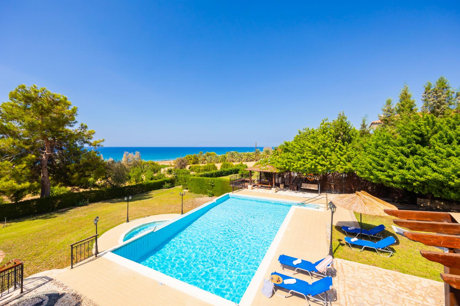 Private pool, terrace, and garden with sea views