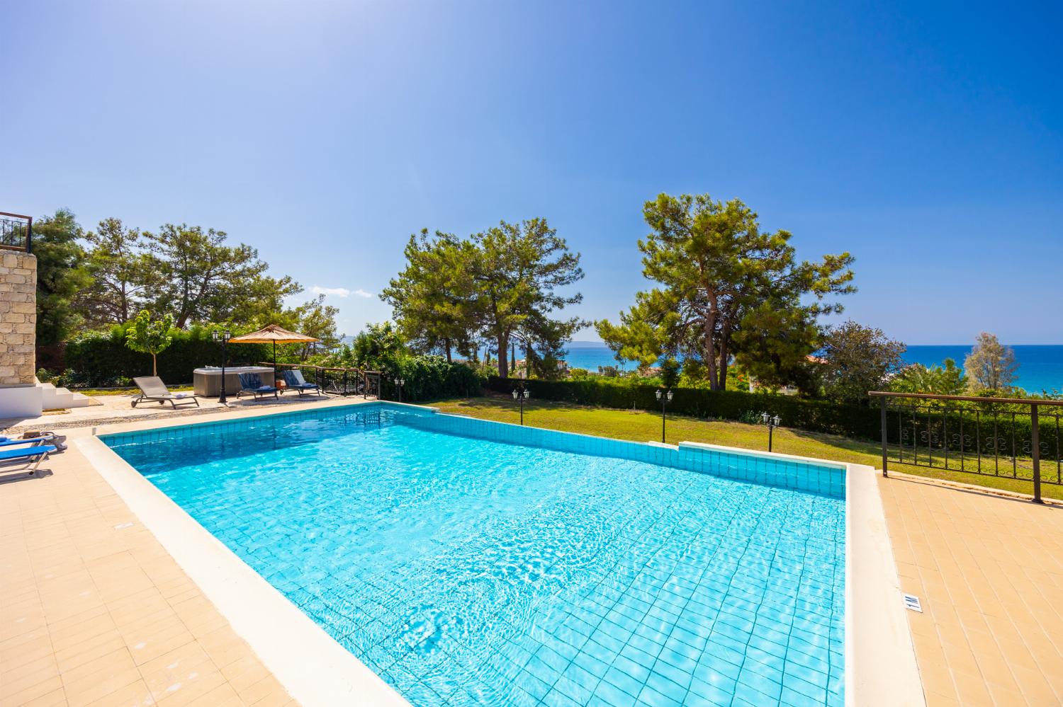 Private pool, terrace, and garden with sea views