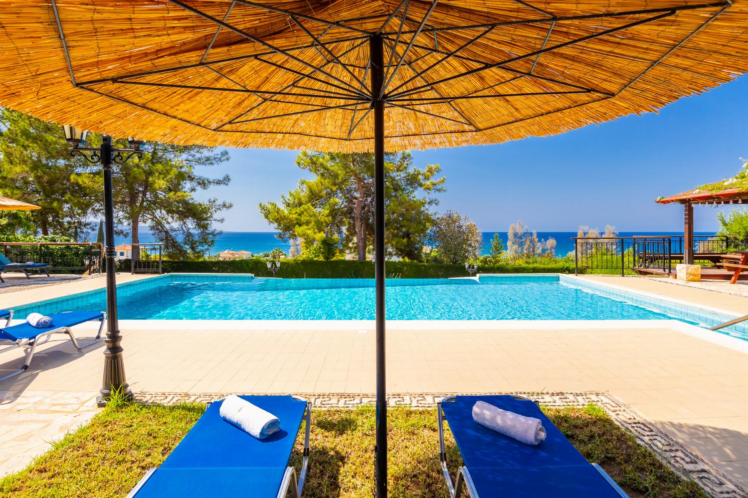 Private pool, terrace, and garden with sea views