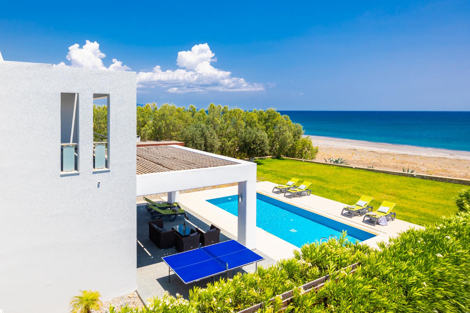 ,Beautiful villa with private pool, terrace, and garden with sea views