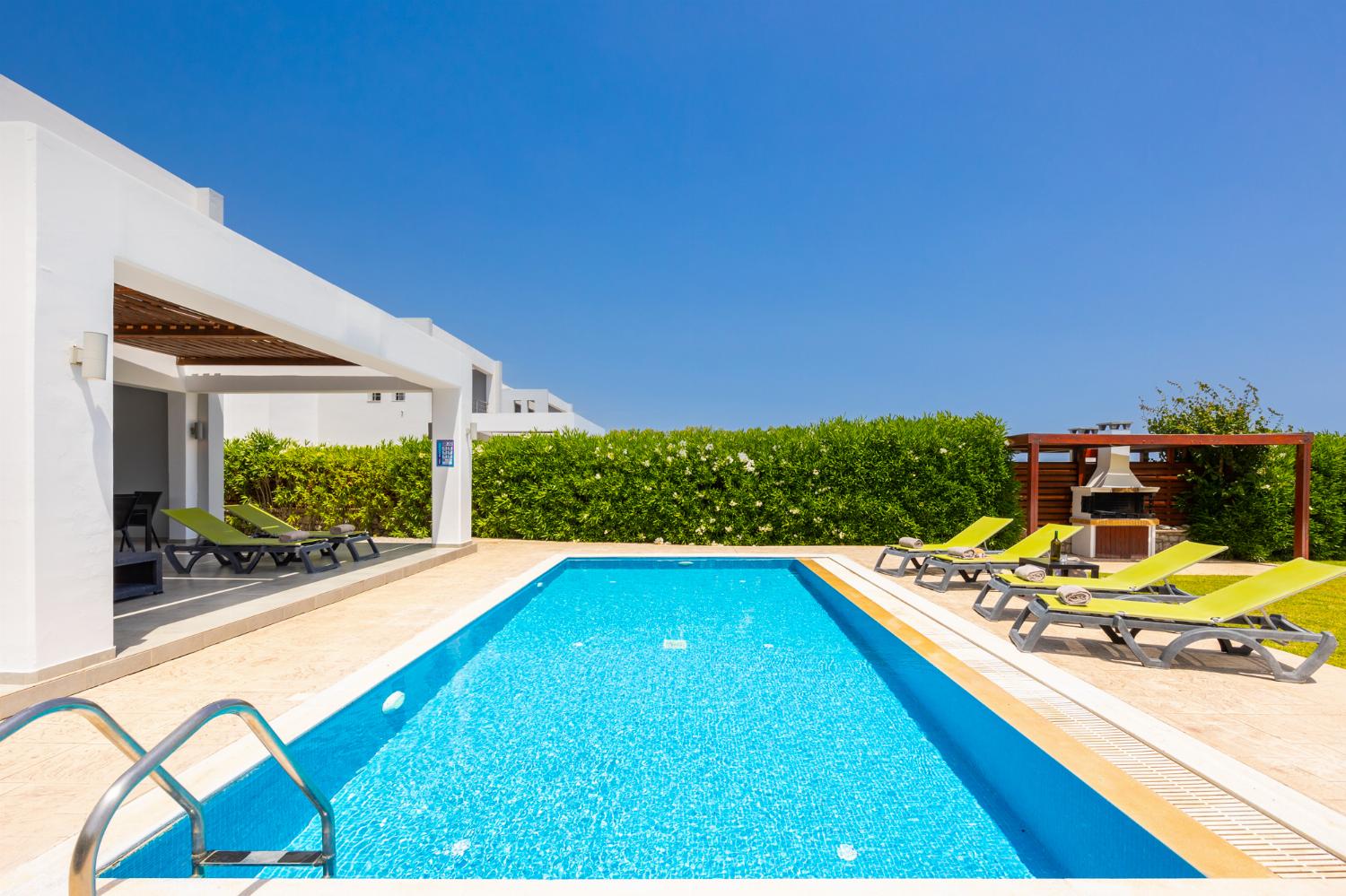 Private pool, terrace, and garden with panoramic sea views