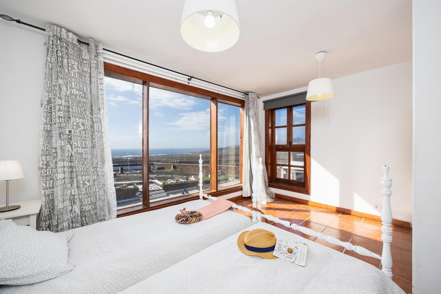 Twin bedroom with sea views