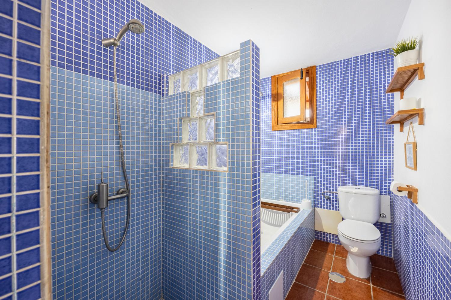 Family bathroom with bath and shower