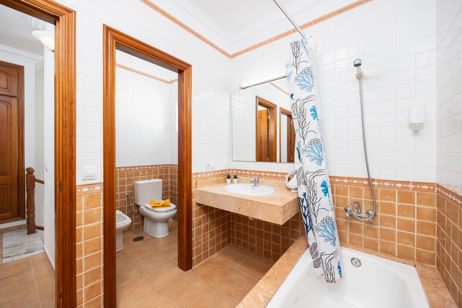 Family bathroom with bath and shower