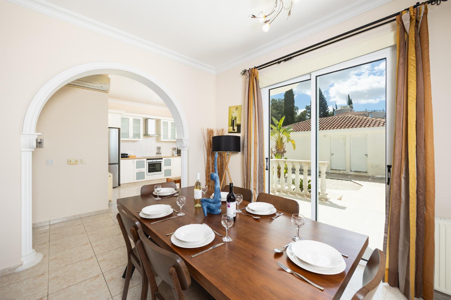 Open-plan living room with sofas, dining area, kitchen, A/C, WiFi internet, satellite TV, and sea views