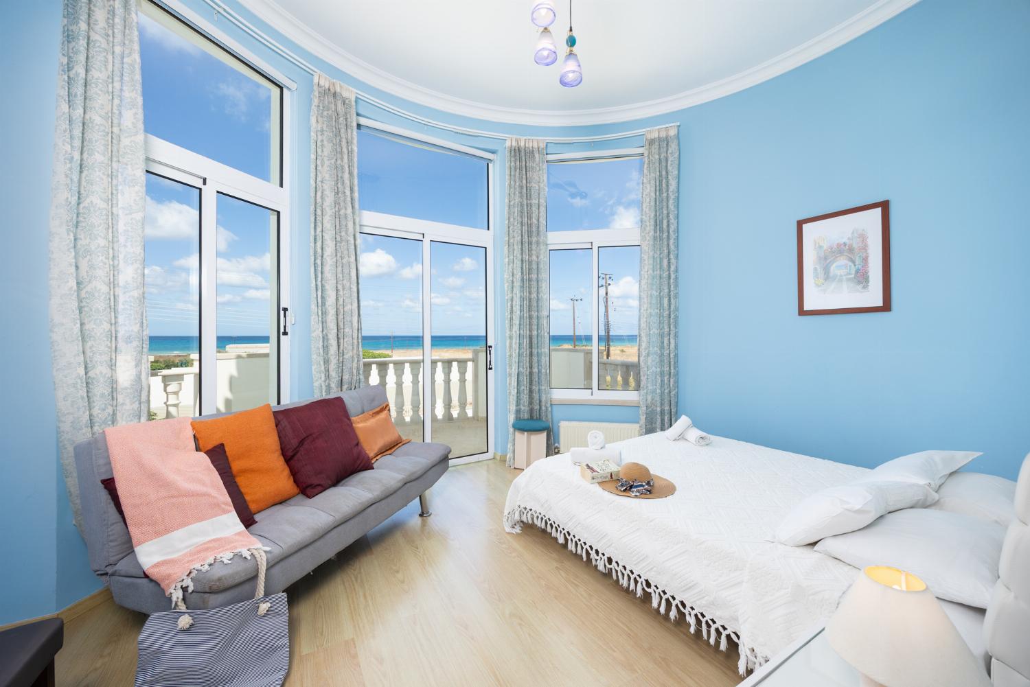 Double bedroom with en suite bathroom, A/C, and sea views