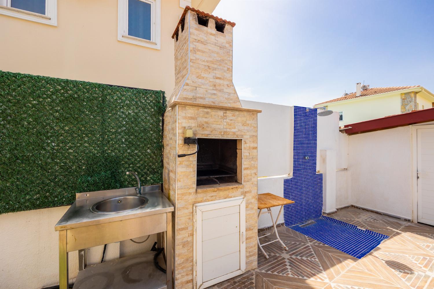 Terrace area with BBQ and outdoor shower