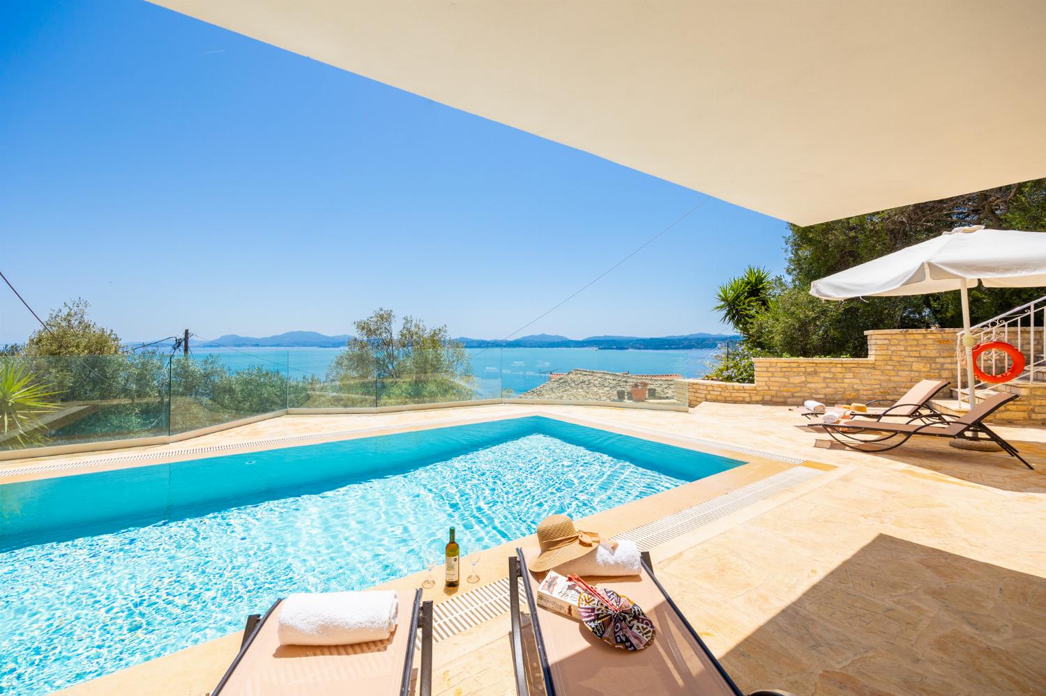 Private pool and terrace area with panoramic sea views