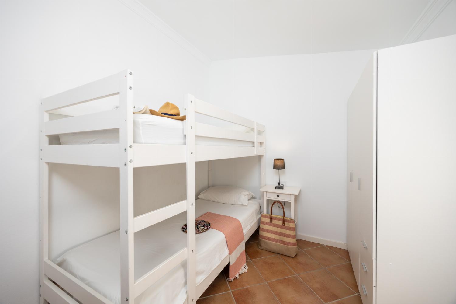 Bedroom with bunk bed and A/C