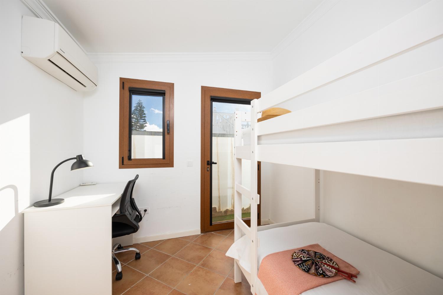 Bedroom with bunk bed and A/C