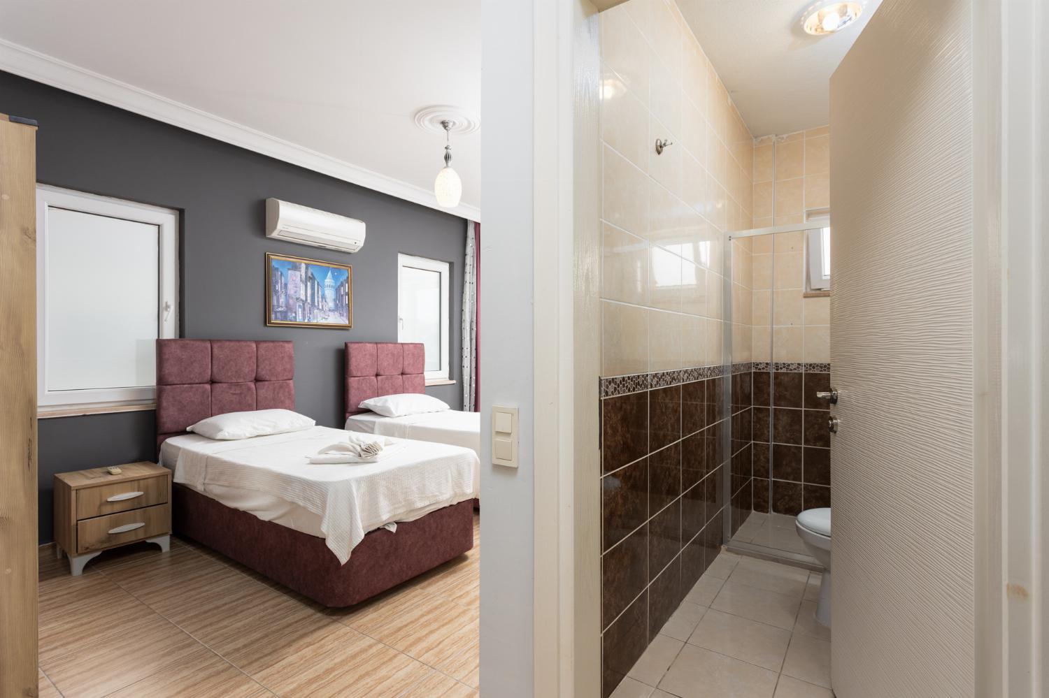 Twin bedroom with en suite bathroom and A/C