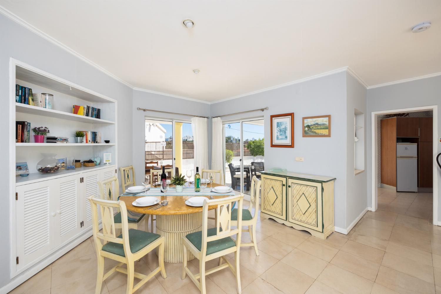 Living room with sofas, dining area, ornamental fireplace, WiFi internet, and satellite TV