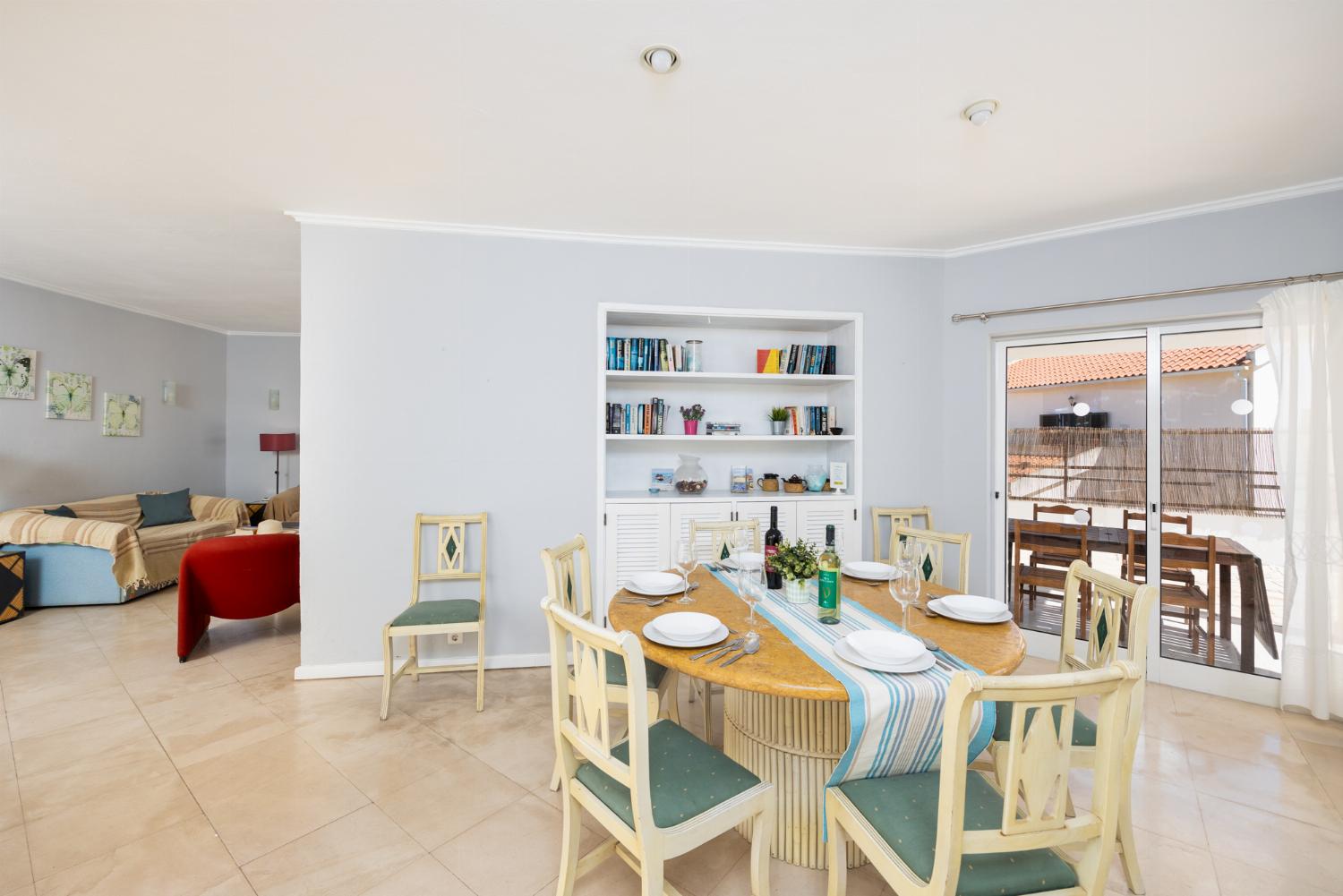 Living room with sofas, dining area, ornamental fireplace, WiFi internet, and satellite TV