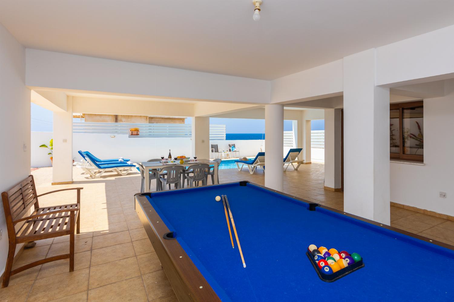 Sheltered terrace with pool table